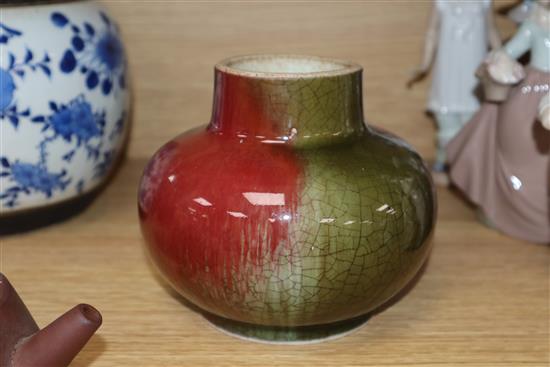 A Chinese squat baluster vase, crackle-glazed in green and red, a blue and white ginger jar and cover and a redware teapot